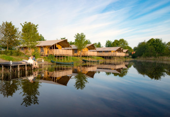 Safari group tent and four luxury glamping tents by the lake at Holiday park Eigen Wijze, Netherlands.