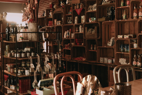 Rustic shelves stocked with local goods at Feather Down Hoeve De Pippert holiday park in Gelderland, Netherlands.