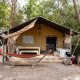 Safari tent Villatent Nomad with hammock, grill and patio at Camping Casa dei Prati in Italy, outdoors.