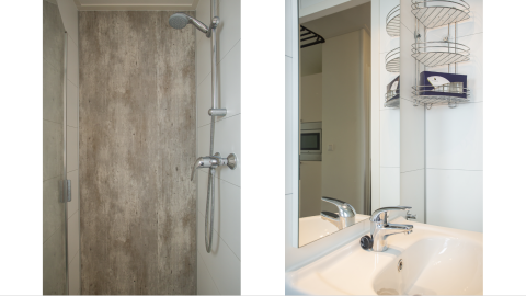 Baño moderno con ducha y lavabo en Heuvelrug Cottage Comfort, De Thijmse Berg, Países Bajos.