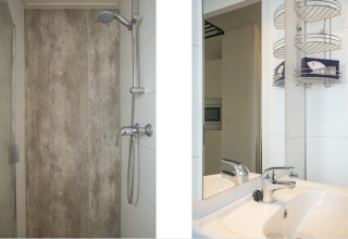 Baño moderno con ducha y lavabo en Heuvelrug Cottage Comfort, De Thijmse Berg, Países Bajos.