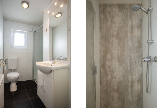 Badkamer bij Heuvelrug Cottage Comfort op De Thijmse Berg in Nederland met toilet, wasbak en douche.