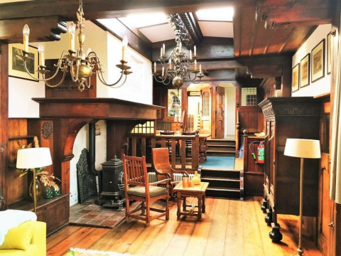 Interior view of Houseboat De Zwerver at Marina Parcs Naarden in the Netherlands with wood decor.