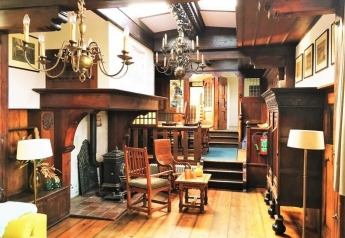 Interior view of Houseboat De Zwerver at Marina Parcs Naarden in the Netherlands with wood decor.