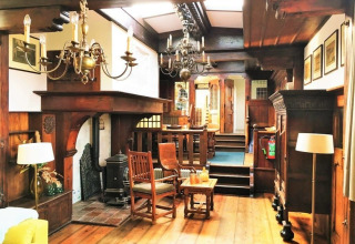 Interior view of Houseboat De Zwerver at Marina Parcs Naarden in the Netherlands with wood decor.