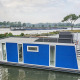 Husbåd Havenlodge+ Amsterdam ved Marina Parcs Amsterdam, fortøjet ved kajen i Nederlandene.
