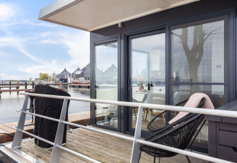 View from the terrace of Houseboat Aqua Dolce at Welcome In - Friesland, Netherlands, with modern decor.