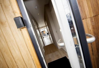 Open front door of Houseboat 'Riggelbrug' at Welcome In - Friesland, Netherlands, showing the hallway inside.