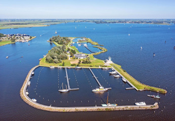 Aerial photo of Houseboat 'Riggelbrug' at Welcome In - Friesland, featuring an island marina in the Netherlands.