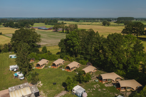 Aerial view of XL safari tents with private sanitary facilities at Holiday Resort 't Schuttenbelt, Netherlands.