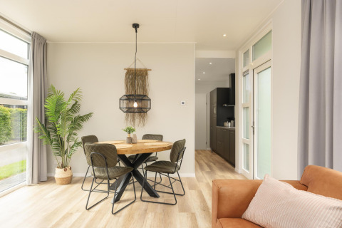 Bright modern dining area at The Water Lily lodge in Holiday Park De Lochemse Berg, the Netherlands.