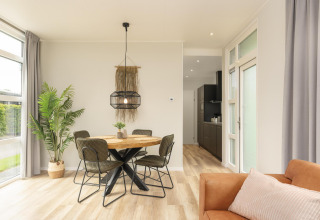 Bright modern dining area at The Water Lily lodge in Holiday Park De Lochemse Berg, the Netherlands.