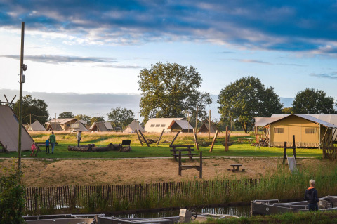 Luxury glamping tents at Holiday Park Mölke, Netherlands, with family area, greenery, and a peaceful setting.