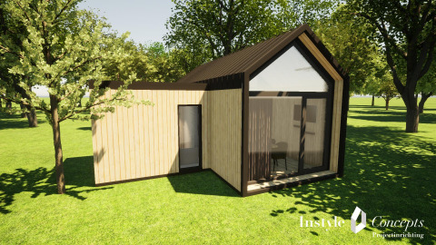 Casa pequeña y moderna XL en Camping Si-Es-An en los Países Bajos, rodeada de árboles y césped verde.