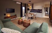 Sala de estar de lodge moderno con sofá verde, mesas de madera y comedor integrado a cocina y dormitorio.