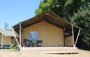 Safari tent with bathroom on wooden deck at Recreation park and Marina Rhederlaagse Meren, Netherlands.