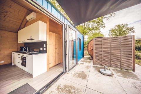 Modern hunting chalet with sauna and outdoor terrace at Holiday park Ackersate, Netherlands, kitchen view.