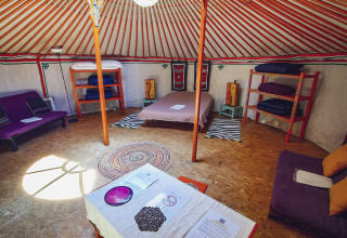 Interior of the XL Yurt Tent without a private bathroom at Camping Des Randonneurs in France.