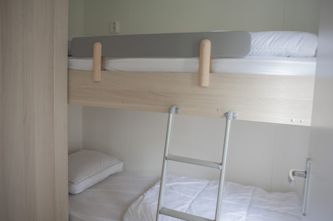 Bunk bed setup in a room at Veluwe Villa, Holiday park De Boshoek, Netherlands, with minimalist decor.