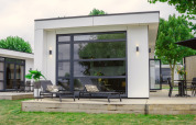 Moderne lodge Villa Maritiem bij MarinaPark Bad Nederrijn in Nederland met terras en comfortabele ligstoelen.