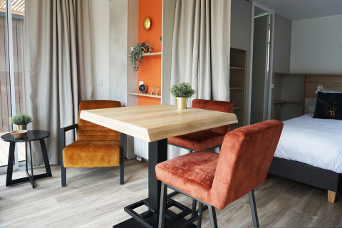 Modern cozy interior of a tiny house at Hotel Lodge, Holiday park De Boshoek, Netherlands.
