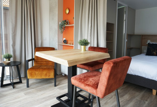 Modern cozy interior of a tiny house at Hotel Lodge, Holiday park De Boshoek, Netherlands.