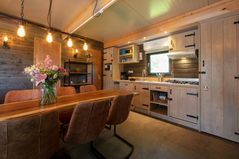 Cozy lodge interior at Castle the Pond Gate, Holiday Park 't Rheezerwold, Netherlands.