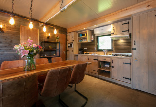 Cozy lodge interior at Castle the Pond Gate, Holiday Park 't Rheezerwold, Netherlands.