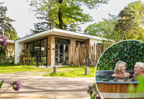 Modern Silva Wellness lodge at Bospark Ede, Netherlands, with hot tub and couple enjoying the outdoor spa.