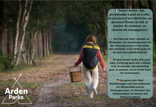 Mujer con mochila y cesta camina por el bosque, promoción de actividades anuales en Arden Parks Francia.